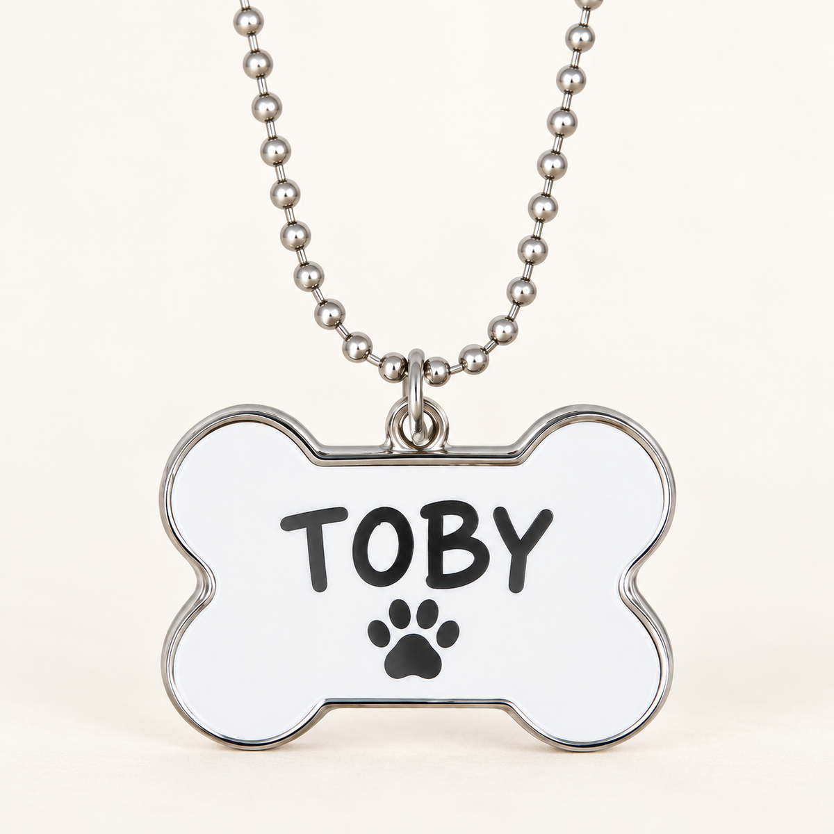 Ejemplo personalizado: Chapa para mascota personalizada · forma de hueso. Montaje orientativo; personalizable con tu foto, nombre o diseño.