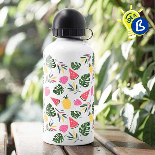 Ejemplo personalizado: Botella personalizada con dos tapones. Diseño orientativo; personalización a tu gusto.